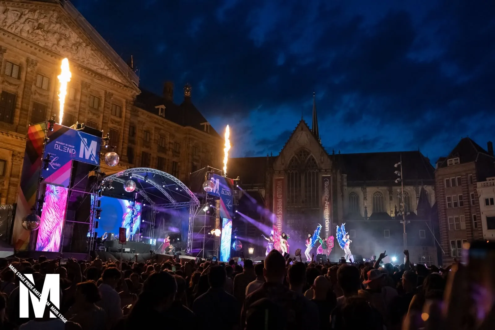Fire effects above the crowd at night on Dam Square, MainStage Pride Amsterdam 2026