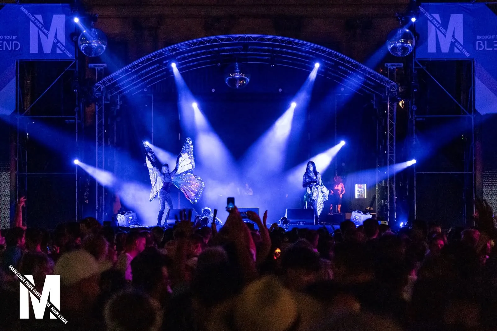Night stage with blue light beams over the crowd, MainStage Pride Amsterdam 2026